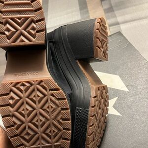 Converse Black Sneakers with Thick Soles and Intricate Tread Pattern